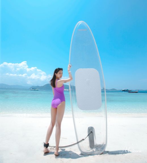 Racha Island & Coral Island Full Day Tour by Speedboat – Snorkeling & Buffet Lunch 11 Tourist enjoying clear paddle board at Coral Island Phuket