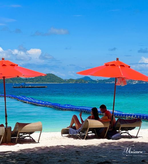Racha Island & Coral Island Full Day Tour by Speedboat – Snorkeling & Buffet Lunch 14 Tourists relaxing on Kahung Beach Coral Island Phuket