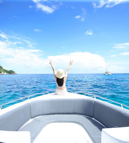 Racha Island & Coral Island Full Day Tour by Speedboat – Snorkeling & Buffet Lunch 16 Tourist enjoying boat trip to Racha Island Phuket
