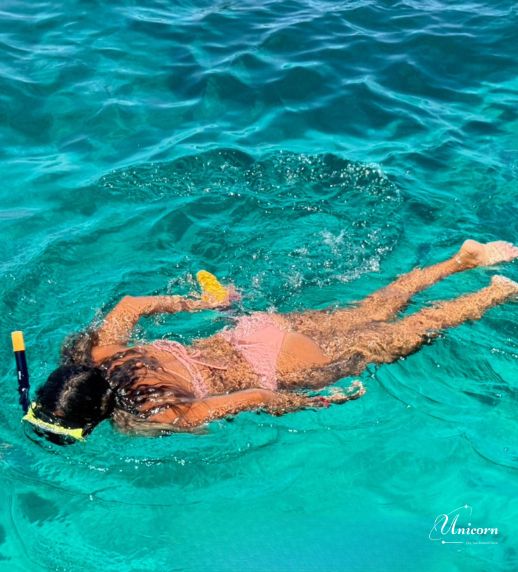 Racha Island & Coral Island Full Day Tour by Speedboat – Snorkeling & Buffet Lunch 10 Woman snorkeling in crystal clear water at Racha Island