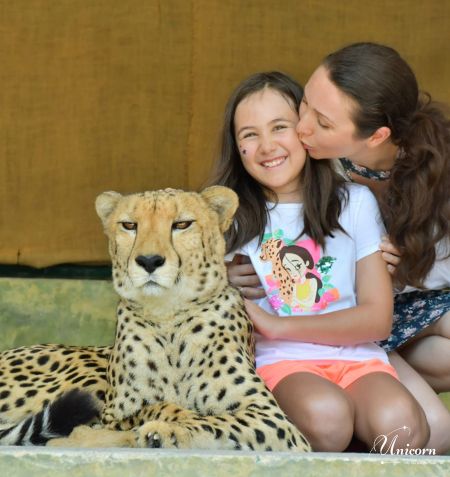 Mother and daughter sharing a sweet moment with cheetah at Tiger Kingdom Phuket