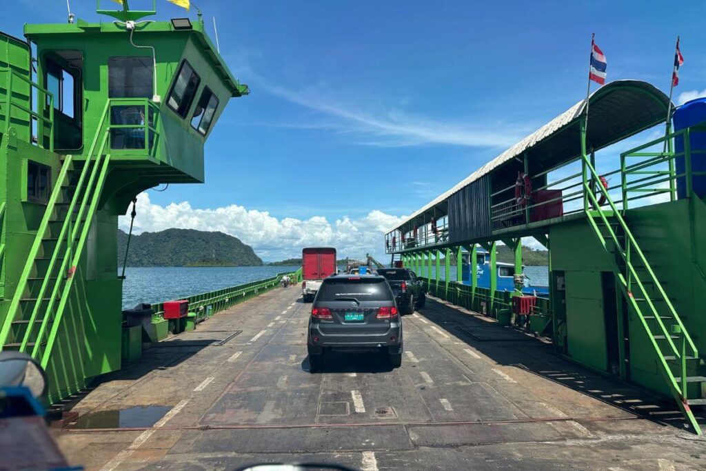 Phuket to Koh Lanta Private Transfer 3 Green car ferry sailing between Krabi and Koh Lanta with scenic sea view