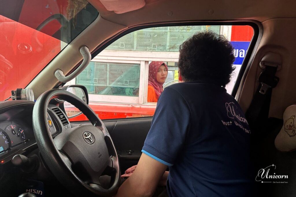 Phuket to Koh Lanta Private Transfer 6 Unicorn Phuket driver buying ferry ticket for Phuket to Koh Lanta car transfer
