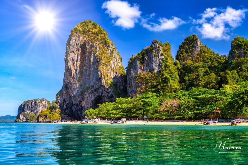 Private Transfer from Phuket to Ao Nang Beach – Fixed Price & Door-to-Door 5 Limestone cliffs and emerald water near Railay Beach, close to Ao Nang